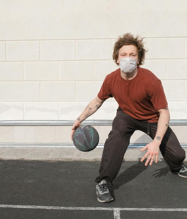 Woman looking peacefully into the distance during sunset outdoors